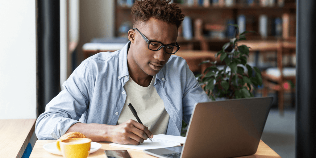 Nigerian professional working remotely using top remote job platforms with secure payment options.