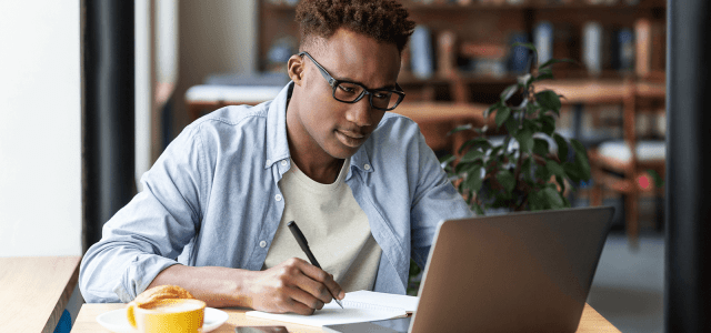 Nigerian professional working remotely using top remote job platforms with secure payment options.
