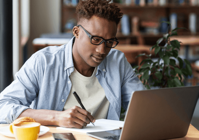 Nigerian professional working remotely using top remote job platforms with secure payment options.