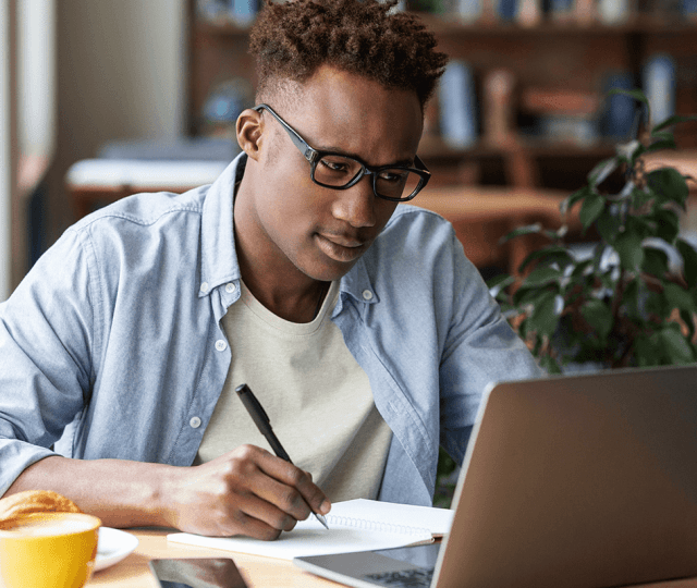 Nigerian professional working remotely using top remote job platforms with secure payment options.