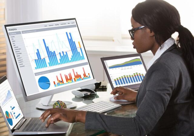 Data analyst in Nigeria reviewing business data and performance reports